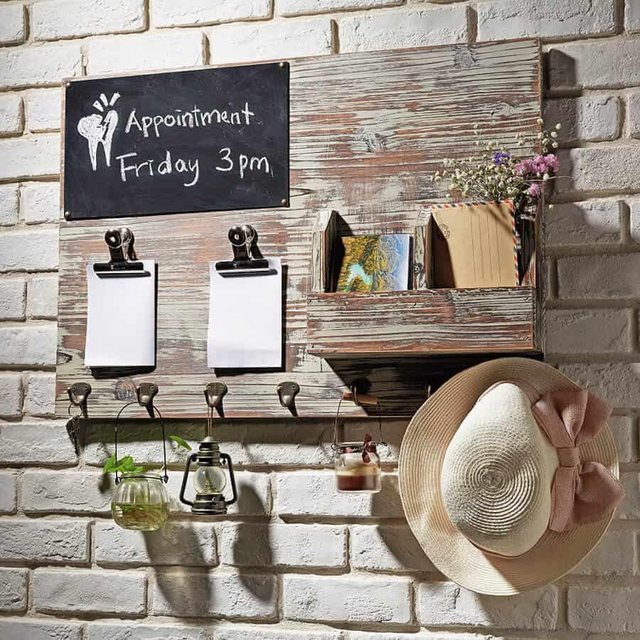 Wall Organizer with hats and clip boards.