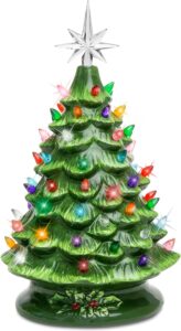 Colorful glass Christmas tree with bright lights and star topper for festive holiday decor.