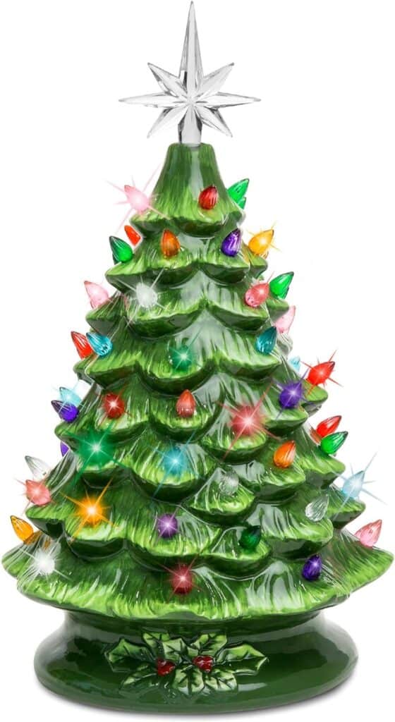 Colorful glass Christmas tree with bright lights and star topper for festive holiday decor.