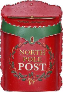 Red holiday-themed mailbox with "North Pole Post" lettering and festive holly decoration, perfect for Christmas mailing decor.