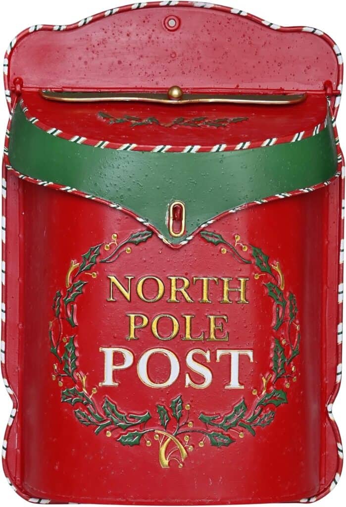 Red holiday-themed mailbox with "North Pole Post" lettering and festive holly decoration, perfect for Christmas mailing decor.