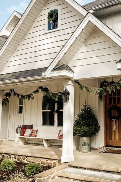 White Modern Farmhouse Exterior Decorated for Christmas.