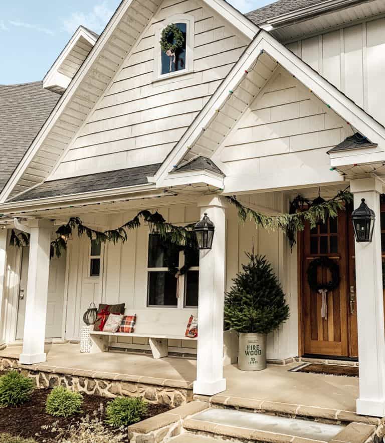 White Modern Farmhouse Exterior Decorated for Christmas.