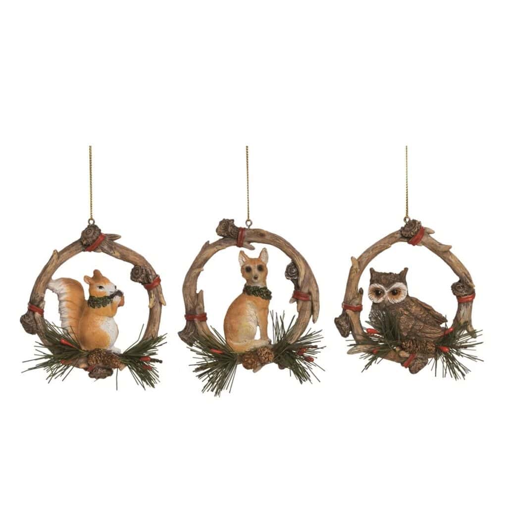Woodland animal Christmas ornaments featuring a squirrel, dog, and owl with pinecone accents and rustic wreath designs.