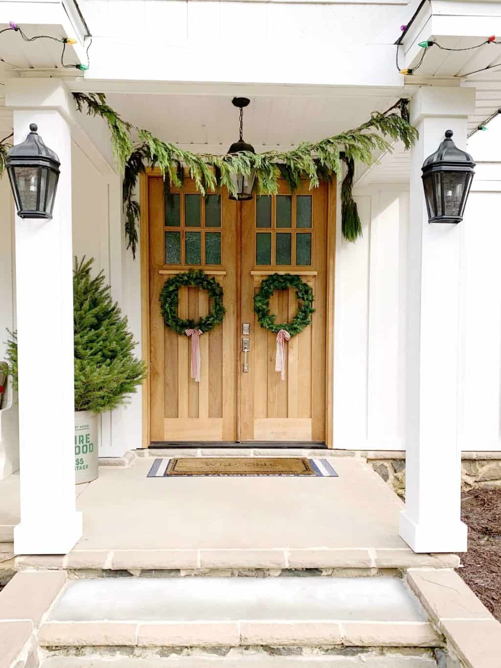 Scandinavian Christmas wreaths hunt on the front door.