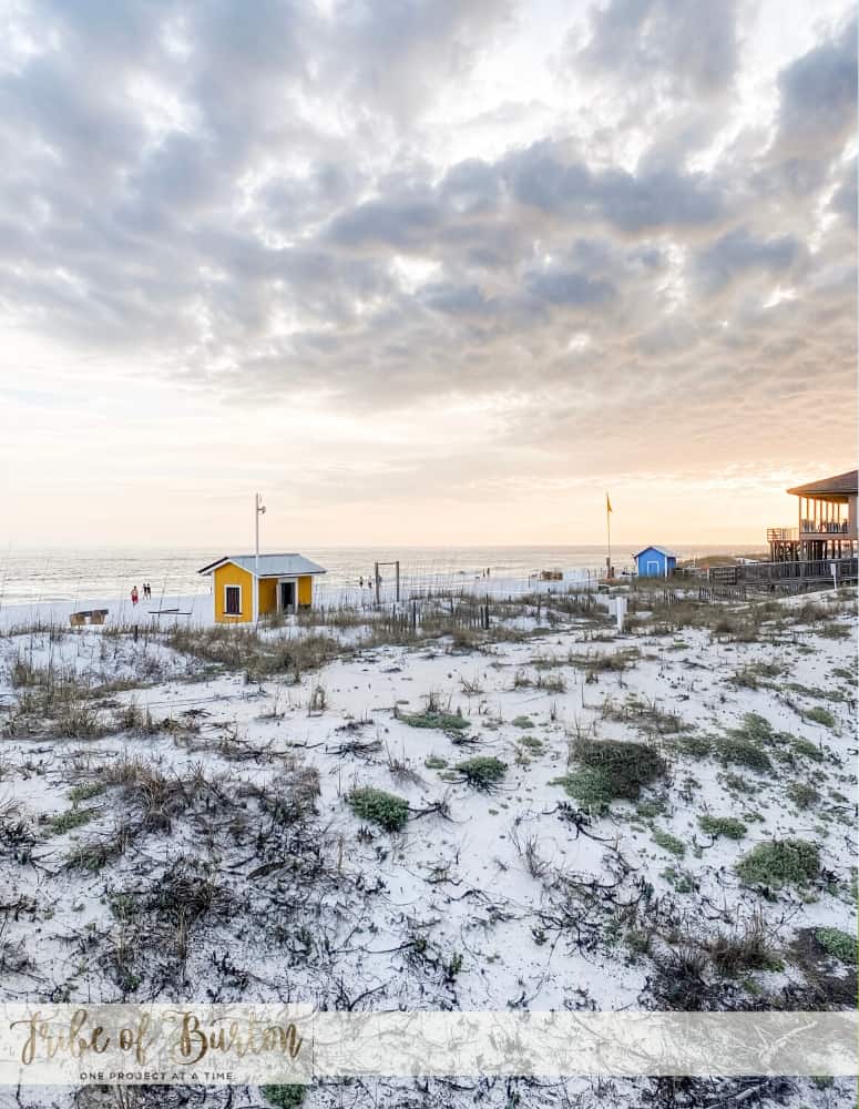 Gulf side of the beach with a clouds and a life guard station