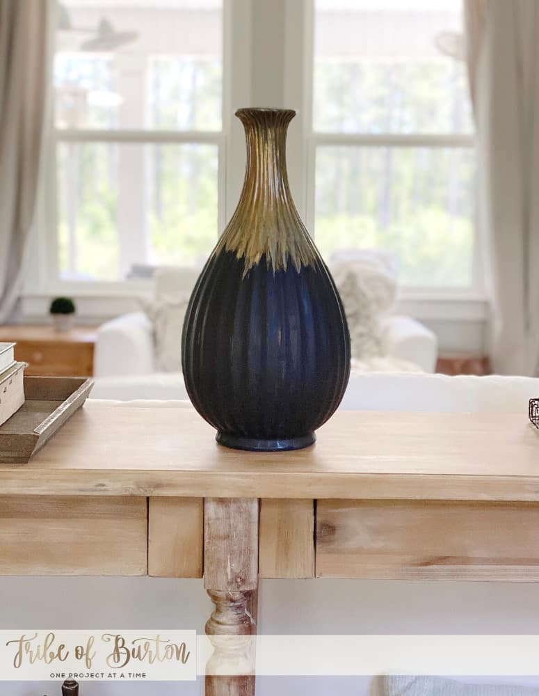 Painted vase on sofa table.