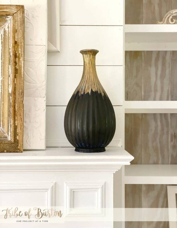 Painted vase on fireplace mantle
