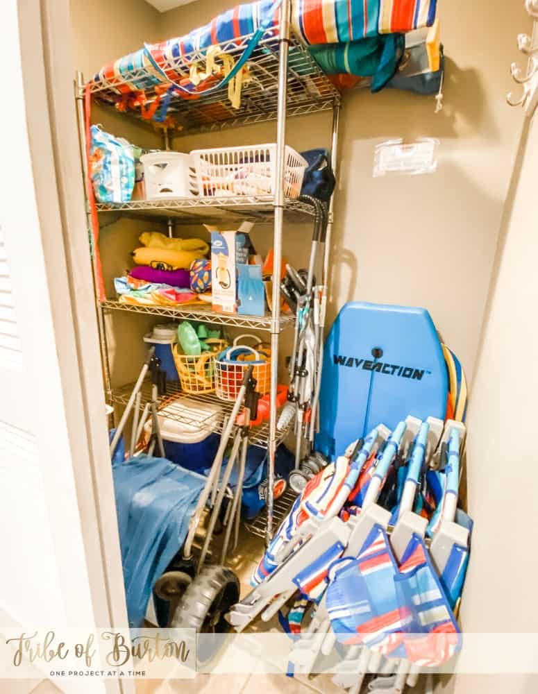 Closet full of beach toys and chairs