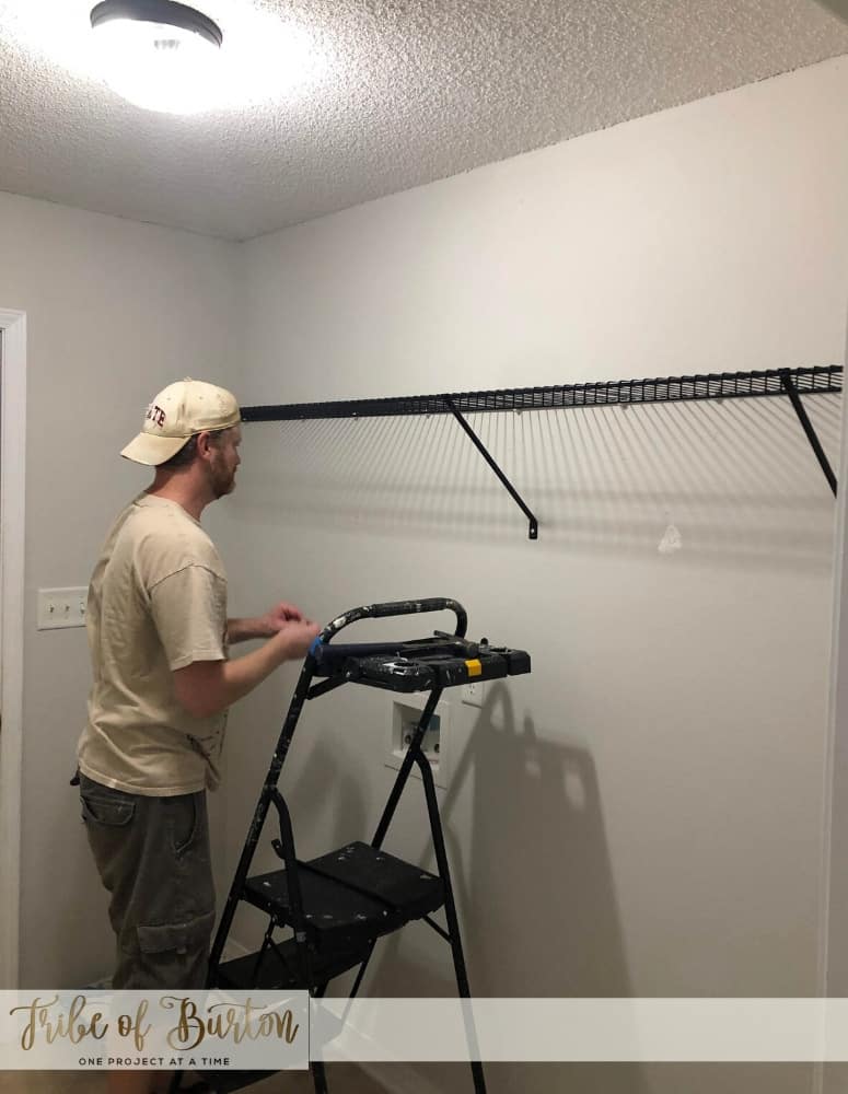 Dark laundry room before quick update.