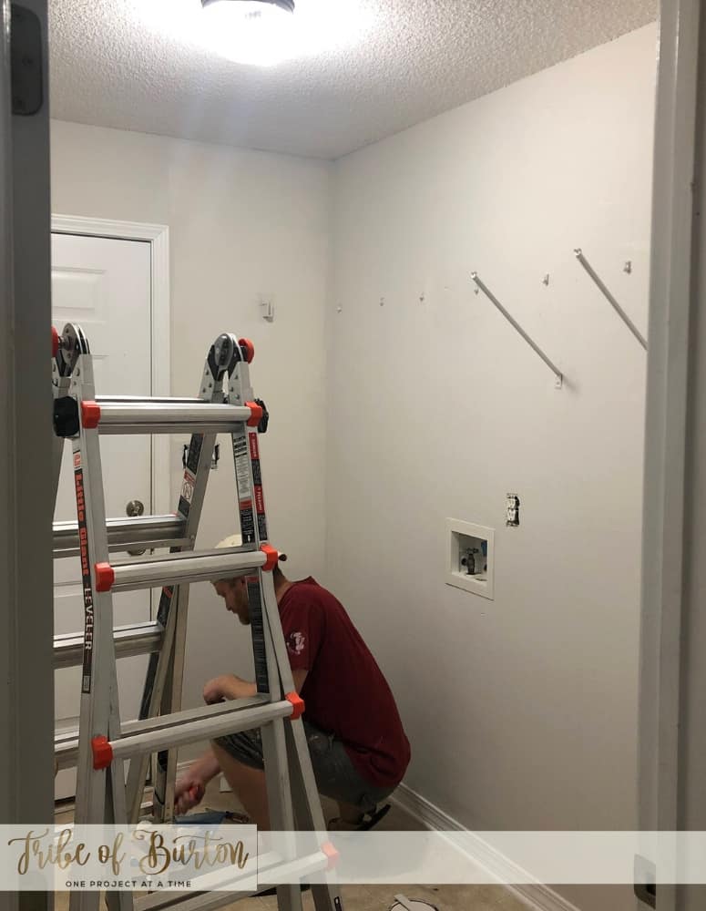 Dark laundry room before quick update.