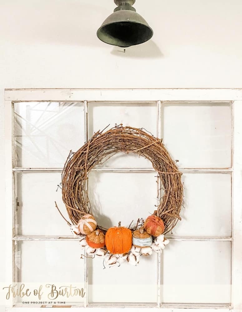 Fall Wreath hanging on an old window.