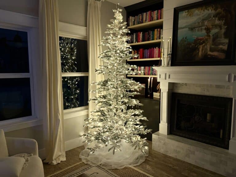 King of Christmas flocked tree at night
