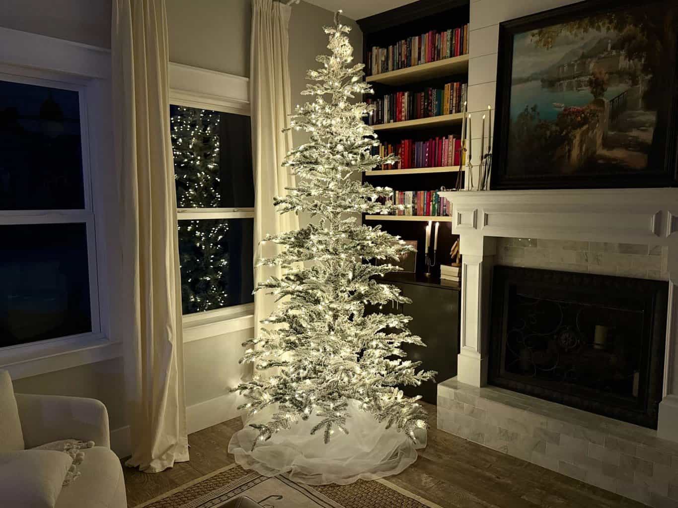King of Christmas flocked tree at night