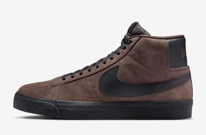 Brown suede high-top Nike sneaker with black accents and textured sole for skateboarding and casual wear.