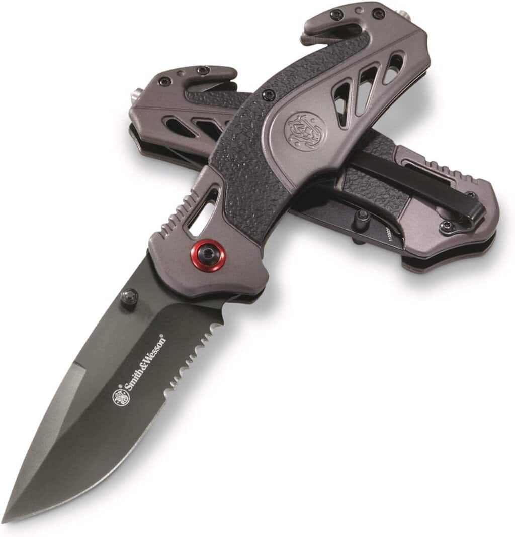 Folding tactical knife with serrated blade for outdoor and hunting use.